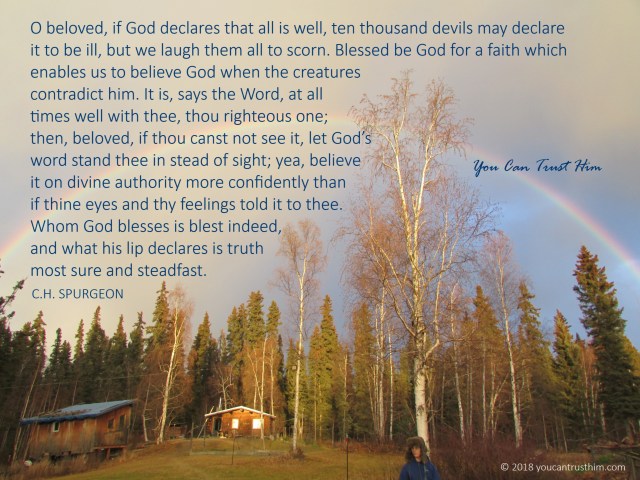 Rainbow over a log cabin